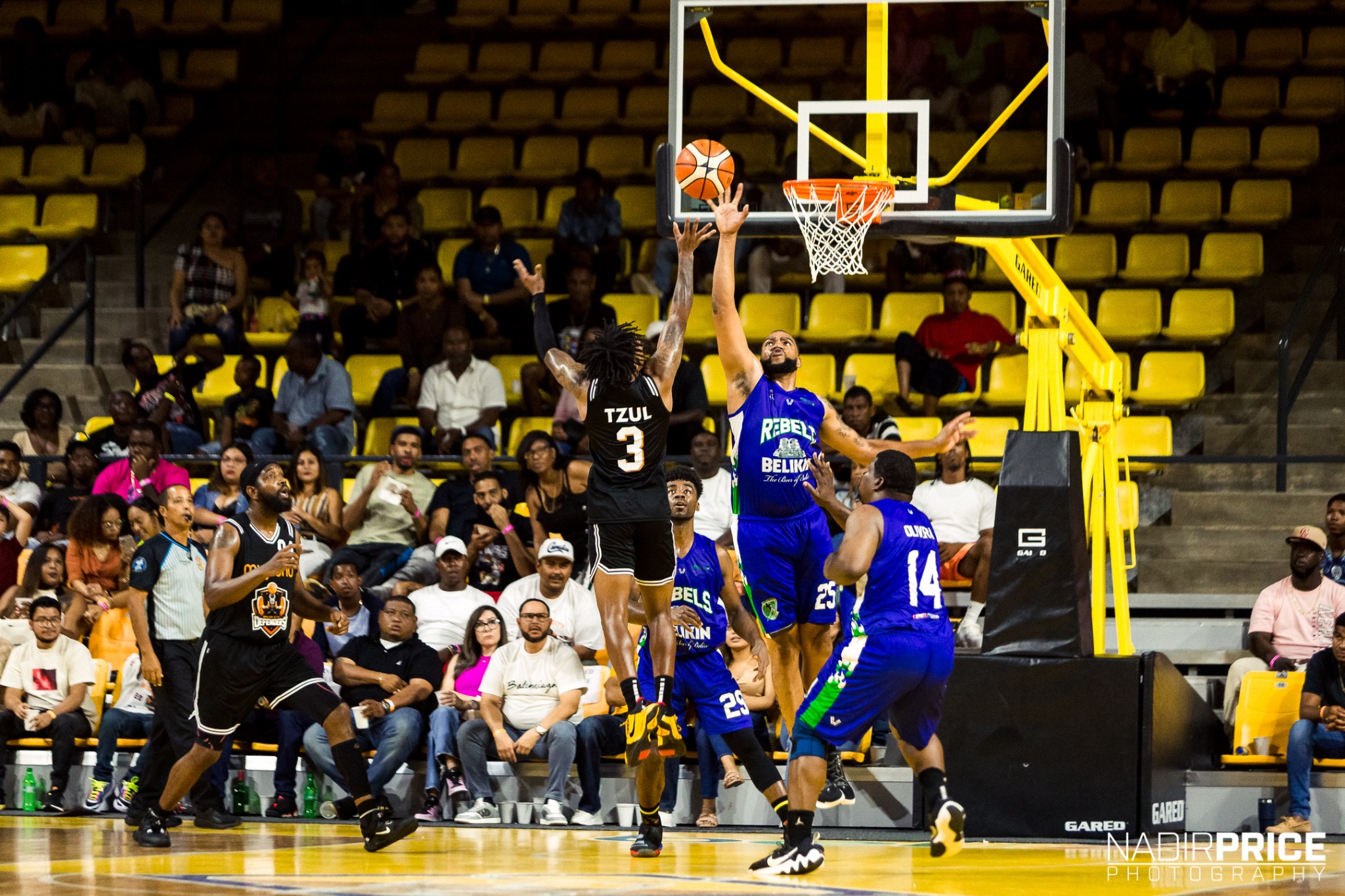 Myke taking a shot in black jersey