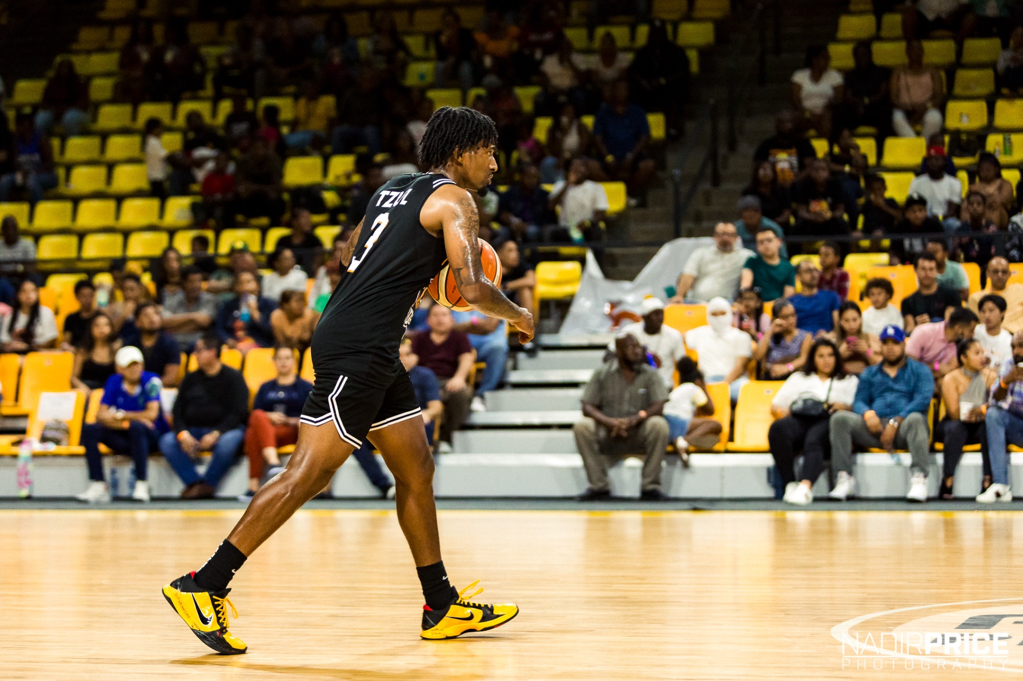 Myke bringing ball up the court